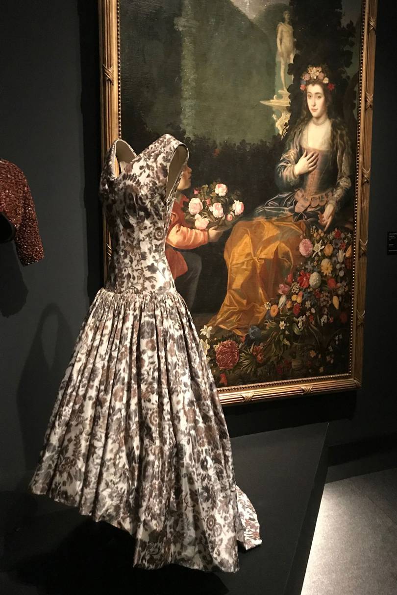 A Balenciaga silk Ikat-weave evening-gown (1958) displayed next to Juan van de Hamen y Leons An Offering to Flora (1627)
Credit: NATASHA COWAN