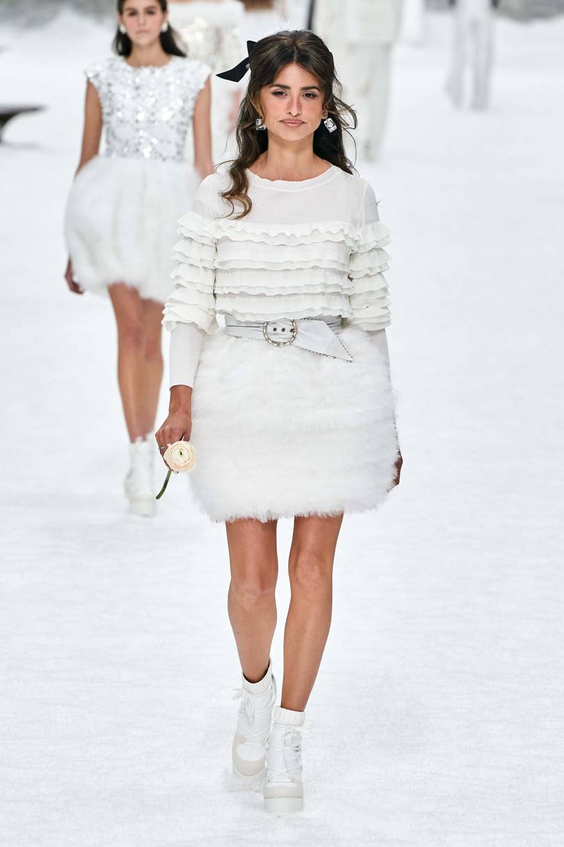 Penelope Cruz took to the runway in a skirt shaped like a snowball and gripping a white rose Credt: ALESSANDRO LUCIONI / GORUNWAY.COM