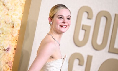 Elle Fanning trudny satynowy trencz przełamuje butami na kaczuszce