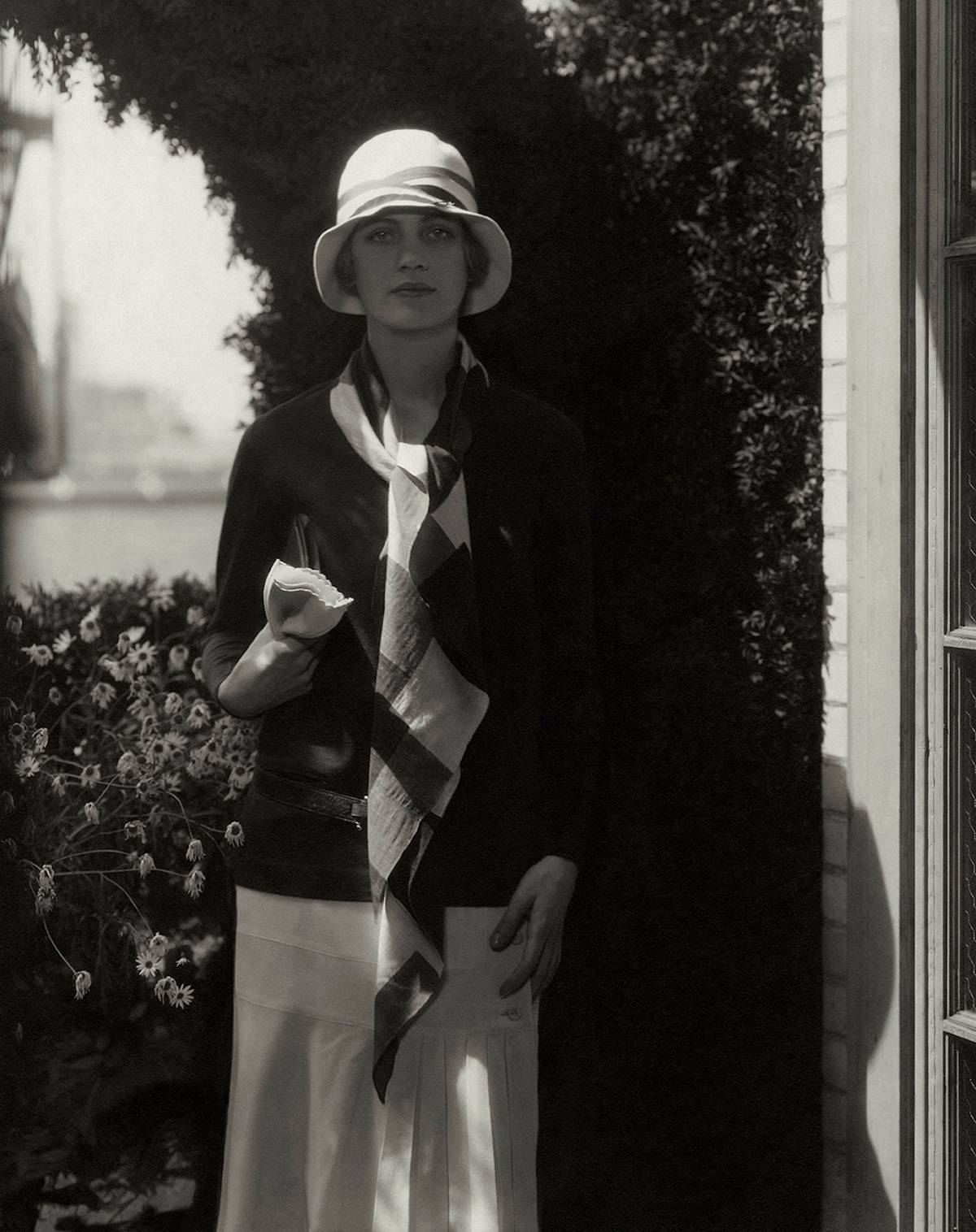Edward Steichen. Lee Miller wearing a Chanel outfit with a hat by Caroline Reboux. Photo published in Vogue, July 15, 1928. © Edward Steichen, Vogue © Condé Nast