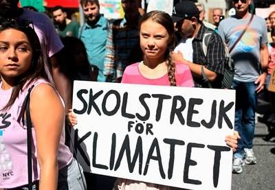 Teen activist Greta Thunberg walks during the Global Climate Strike march on September 20, 2019 in New York City. © Getty Images