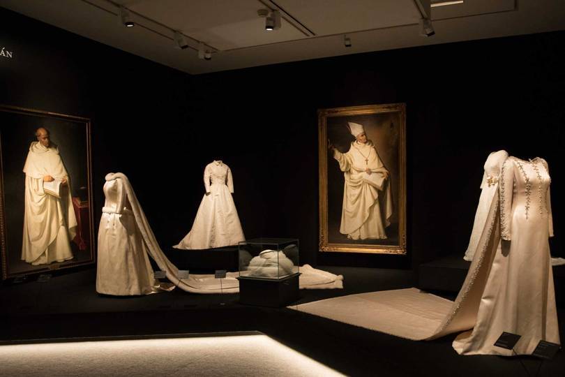 Far left, a fur-trimmed wedding dress that Balenciaga made for Queen Fabiola of Belgium in 1960, set against portraits by Francisco Zurbarán (1628-34) Credit: @BORJALAMA