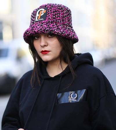 Prada hat with a Raf Simons sweater, 2018 - the designers are now coming together formally
© Jeremy Moeller/Getty