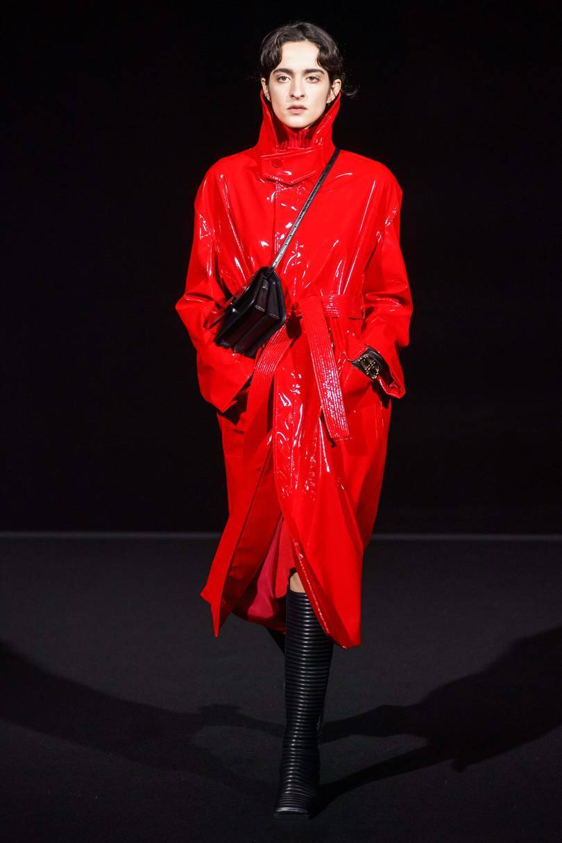 A shiny raincoat reflected the subtle differences between the mens and womens collections. Credit: ALESSANDRO LUCIONI / GORUNWAY.COM,