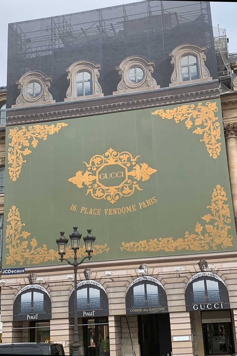 The giant Gucci advertising hoarding in Place Vendôme, announcing the arrival of the new Gucci bijoux boutique, which opened in July
Credit: @SUZYMENKESVOGUE