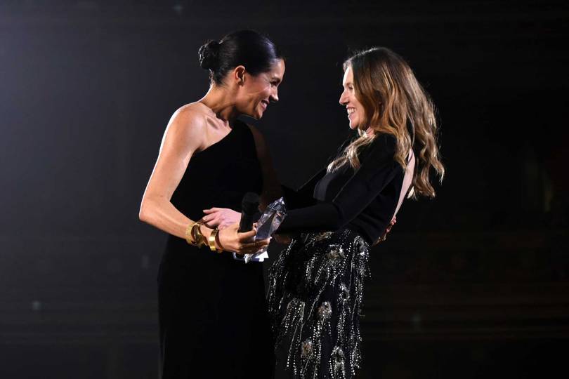 Meghan, Duchess of Sussex, presents the British Designer of the Year Womenswear Award 2018 to Clare Waight Keller of Givenchy. Credit: GETTY