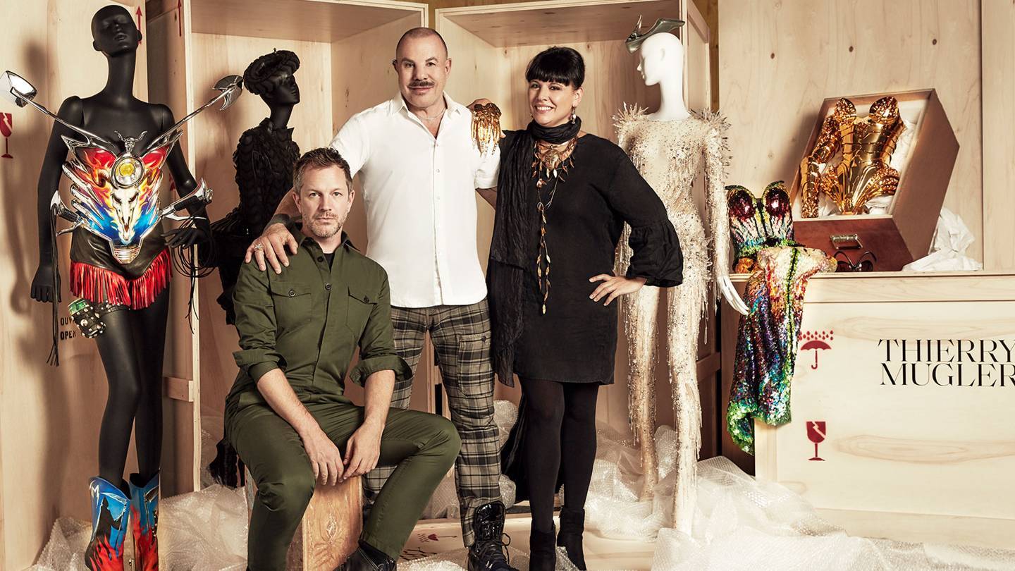 From left, award-winning curator Thierry-Maxime Loriot with creator Manfred Thierry Mugler and Nathalie Bondil, Director General and Chief Curator of the Montreal Museum of Fine Arts behind the scenes of their new exhibition, Thierry Mugler: Couturissime
Credit: © MAX ABADIA