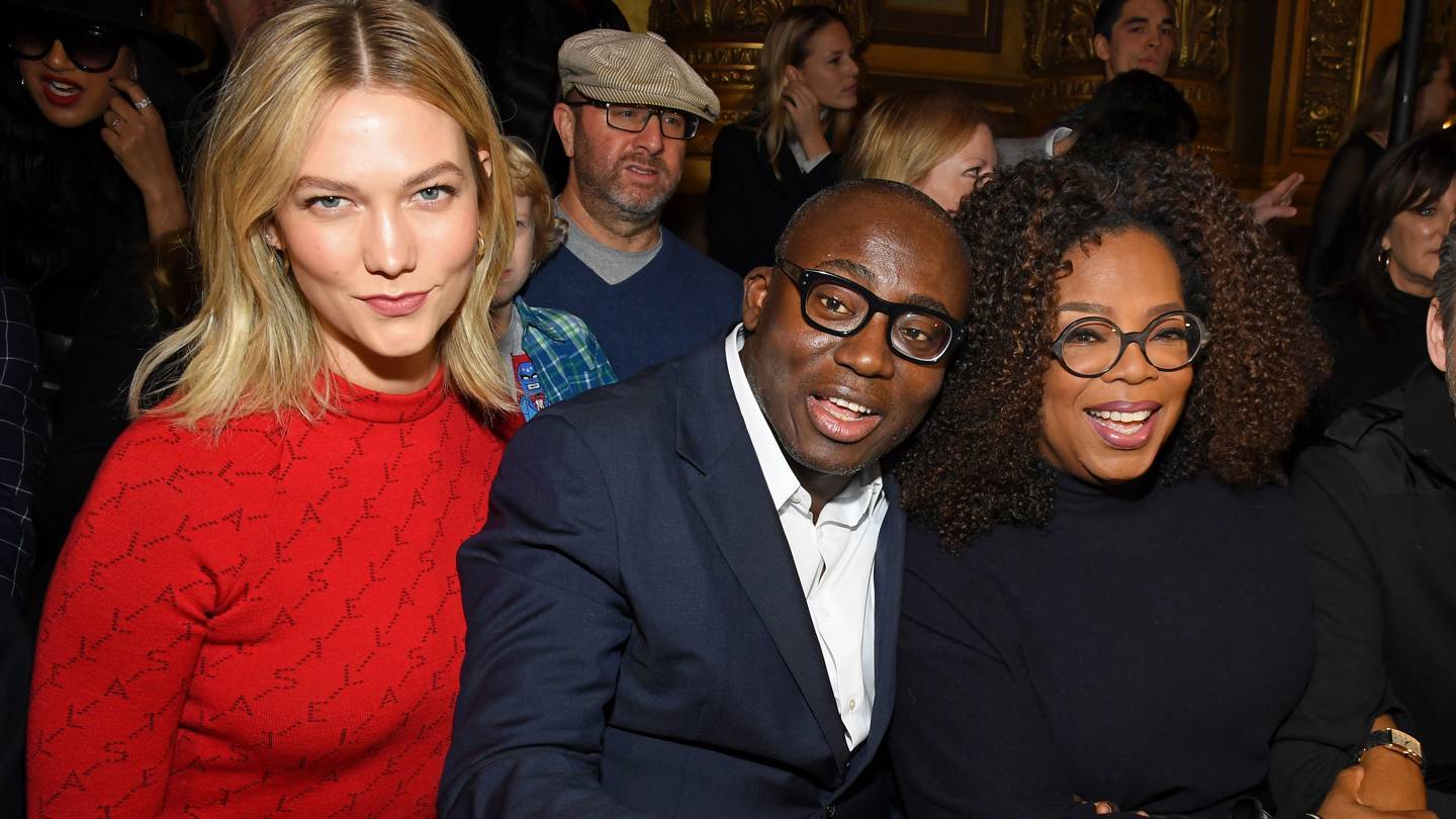 Oprah Winfrey at the Stella McCartney show with Karlie Kloss and Edward Enninful. Credit: GETTY IMAGES