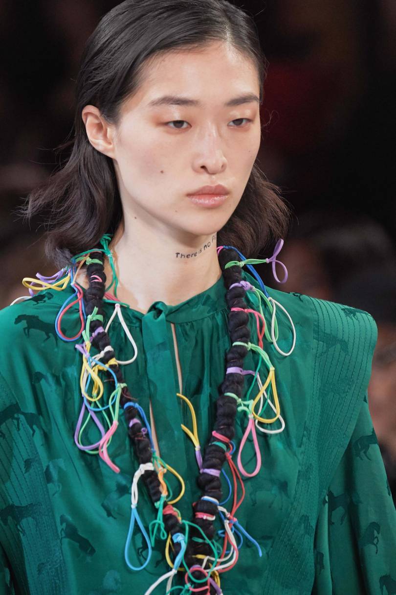Dangling rubber bands were a jocular touch in the adornment of the collection. Credit: ARMANDO GRILLO / GORUNWAY.COM
