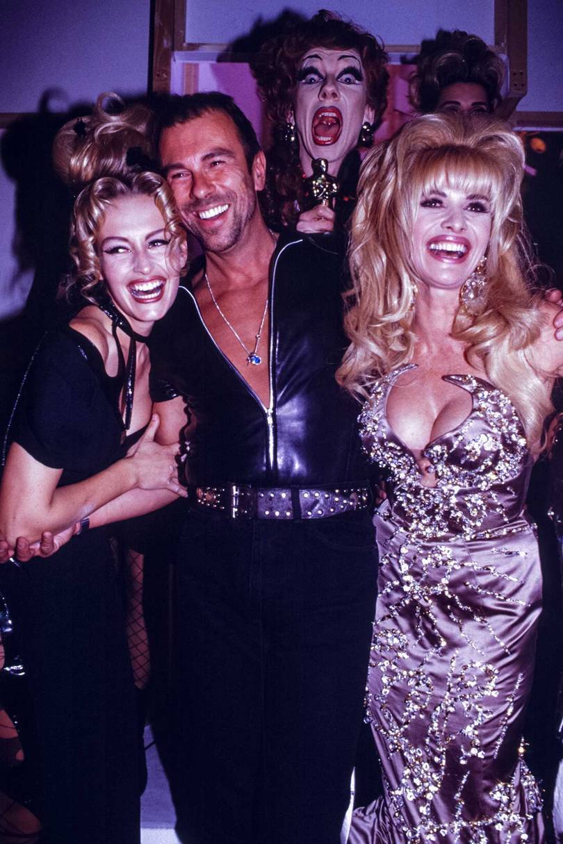 From left, Estelle Lefébure, Thierry Mugler and Ivana Trump at his Prêt-à-Porter Spring/Summer 1992 show in Paris, October 1991
Credit: GETTY IMAGES