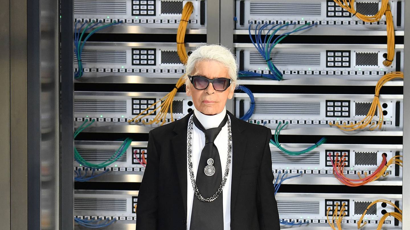 Karl Lagerfeld at the finale of his Chanel Spring/Summer 2017 show, with a typically theatrical set that transformed the Grand Palais into a futuristic hub of computer mainframes. Credit: GETTY IMAGES