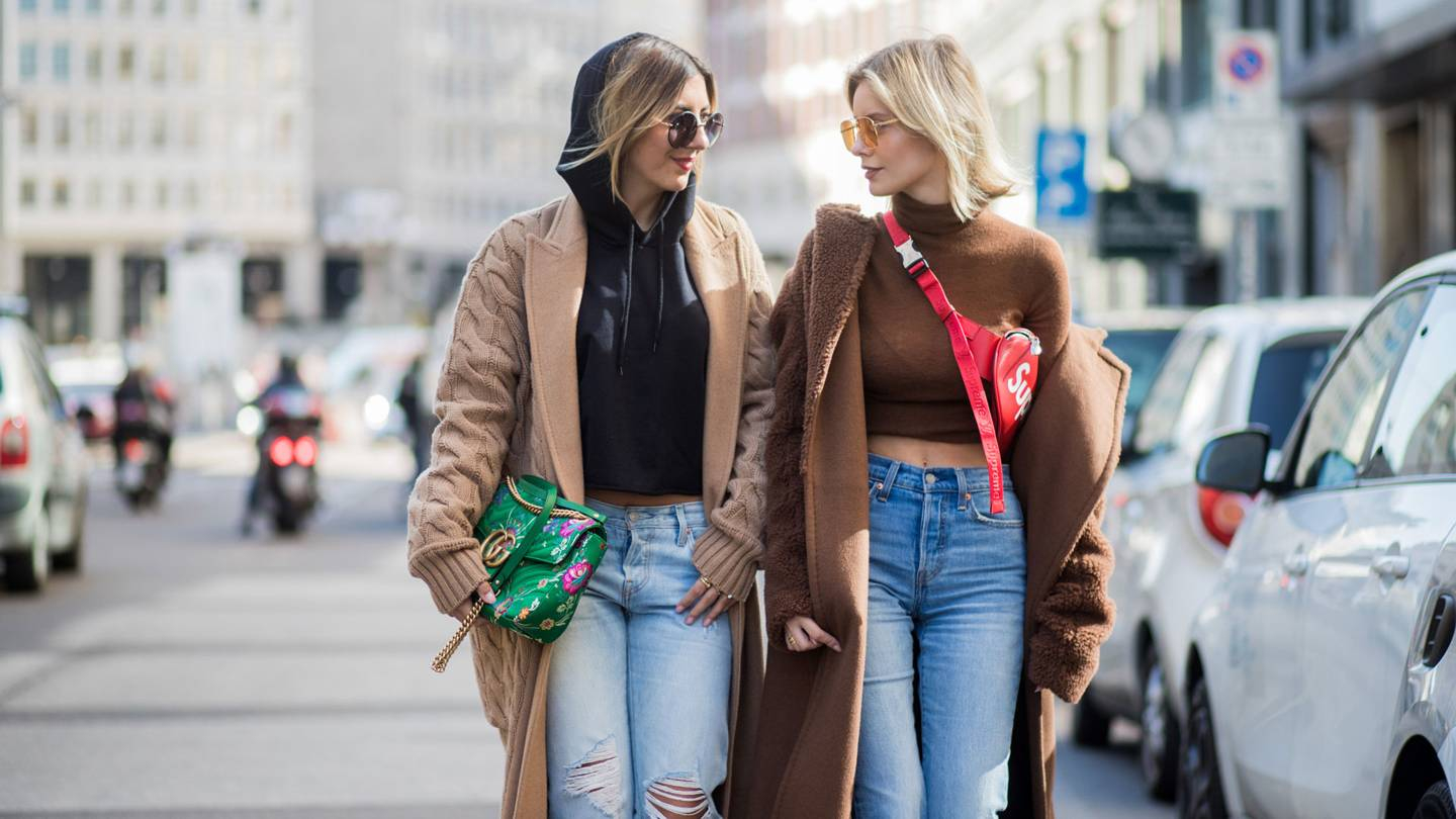 Gucci bag worn by Aylin Koenig and Supreme x Louis Vuitton belt bag worn by Lisa Hahnbueck, Milan Fashion Week Spring Summer 2018 (GETTY)