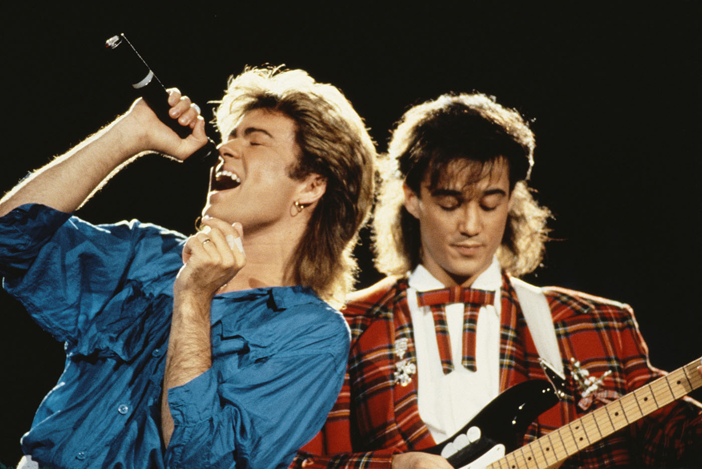George Michael i Andrew Ridgeley czyli zespol Wham! podczas trasy koncertowej w 1985 roku (Fot. Michael Putland/Getty Images)