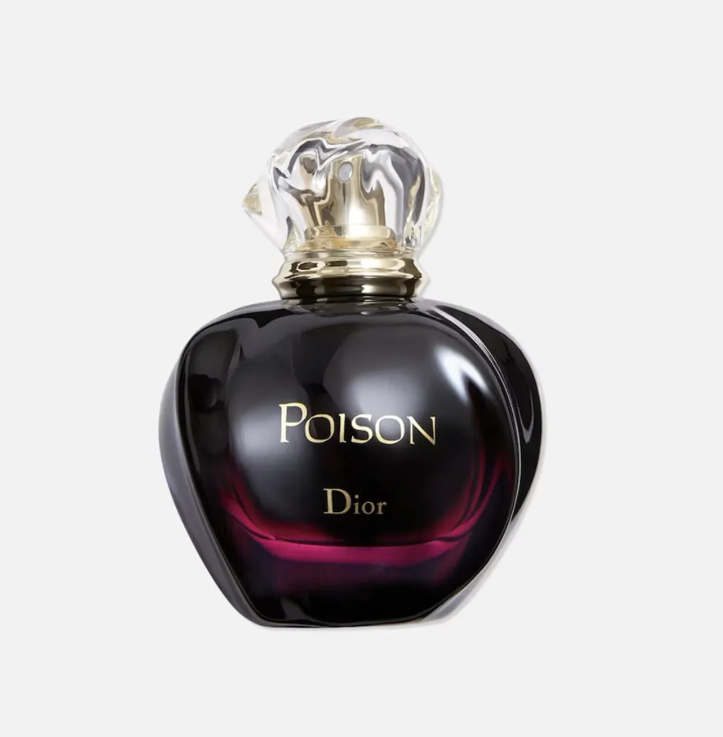 Flakon perfum Poison marki Dior, w kształcie serca, w ciemnej, eleganckiej kolorystyce z przezroczystą nakrętką.