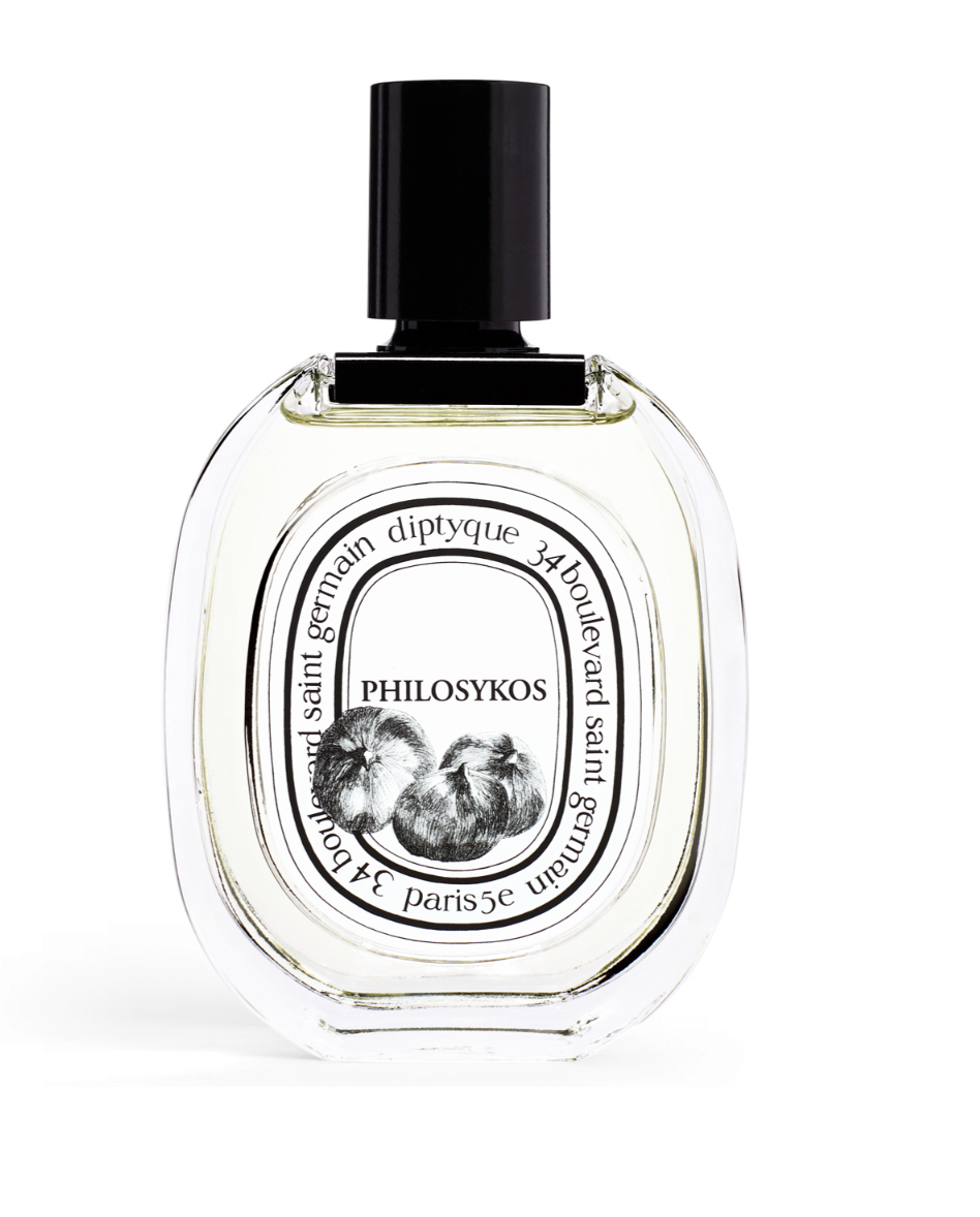 Charakterystyczna butelka perfum Diptyque  PHILOSYKOS o owalnym kształcie z ryciną przedstawiającą figi.