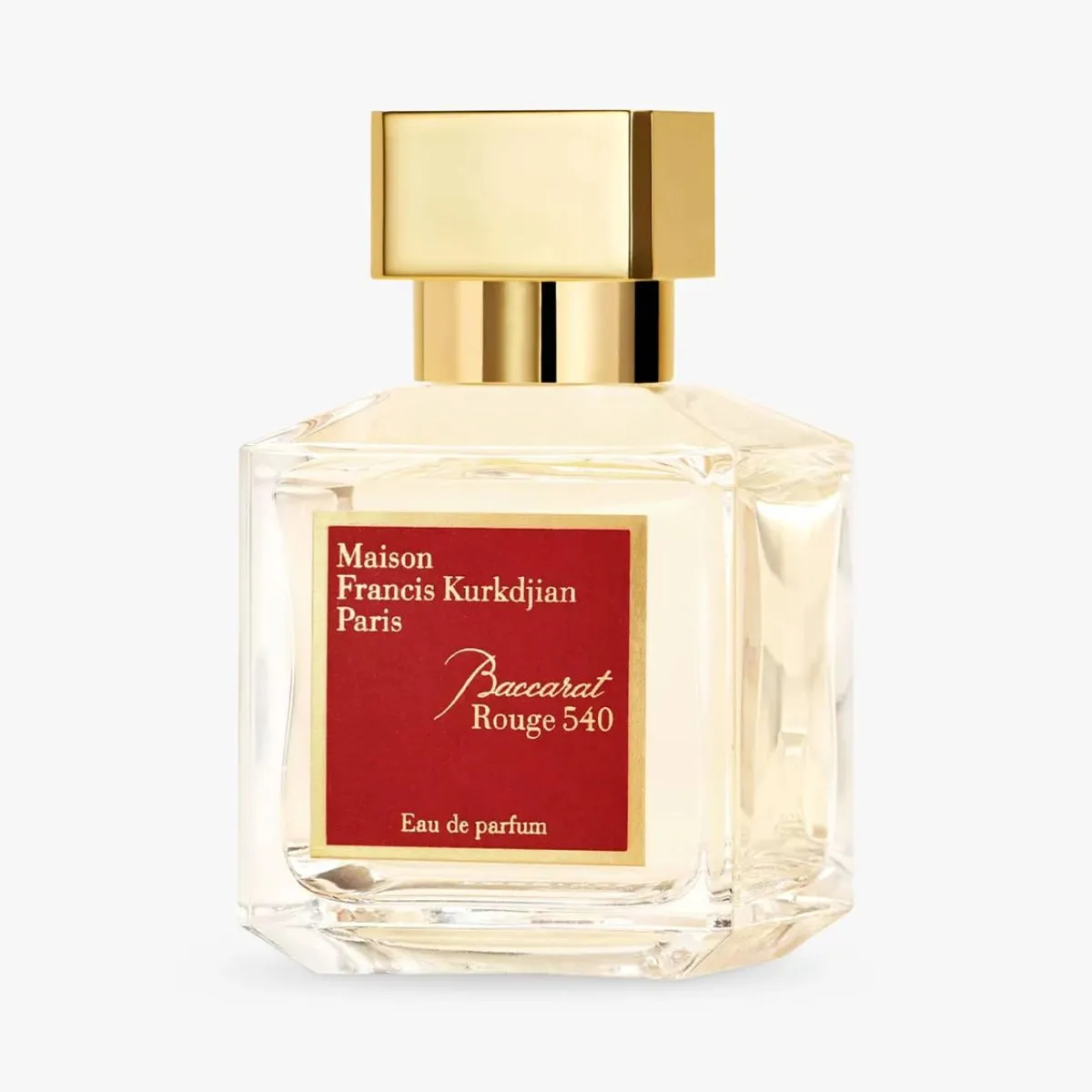 Perfumy w eleganckiej, prostokątnej butelce z złotą nakrętką i czerwoną etykietą, opisujące "Maison Francis Kurkdjian Baccarat Rouge 540".