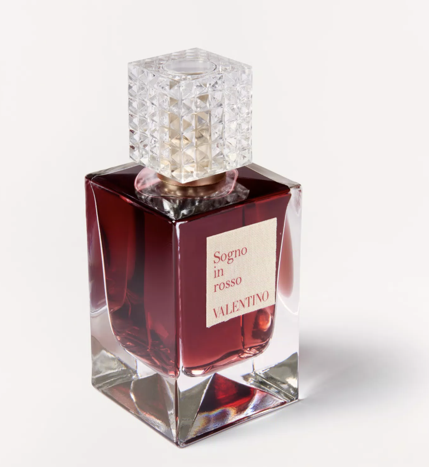 Elegancka butelka perfum Valentino &quot;Sogno in rosso&quot; idealna na jesień. Ciemnoczerwona ciecz z ozdobnym korkiem.