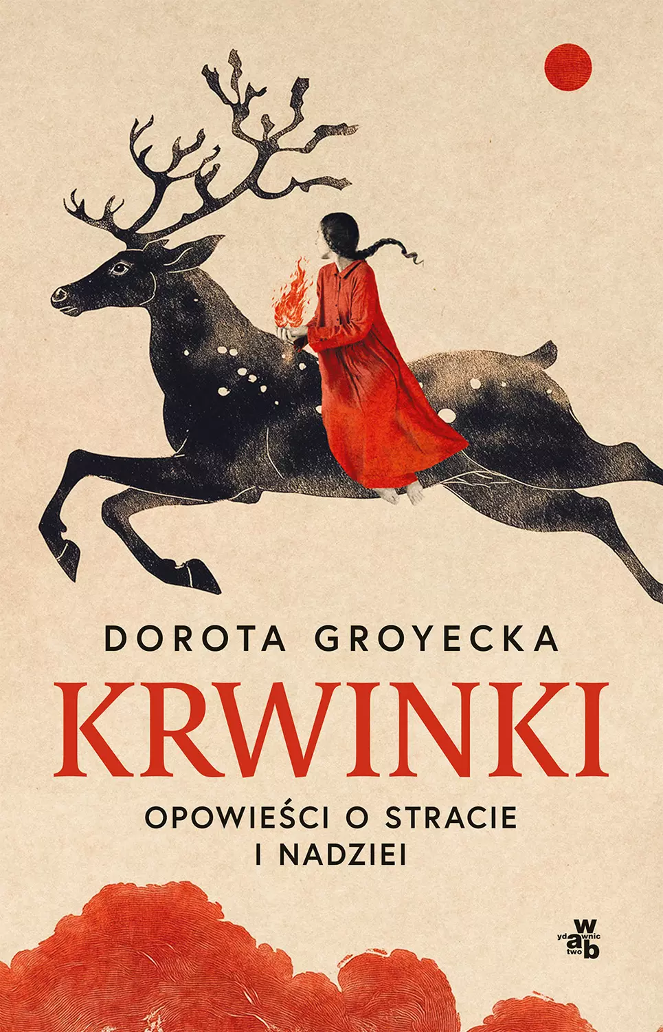 Na okładce widać kobietę w czerwonej sukni trzymającą ogień, siedzącą na czarnym reniferze. Tło w jasnym kolorze z czerwonym słońcem.