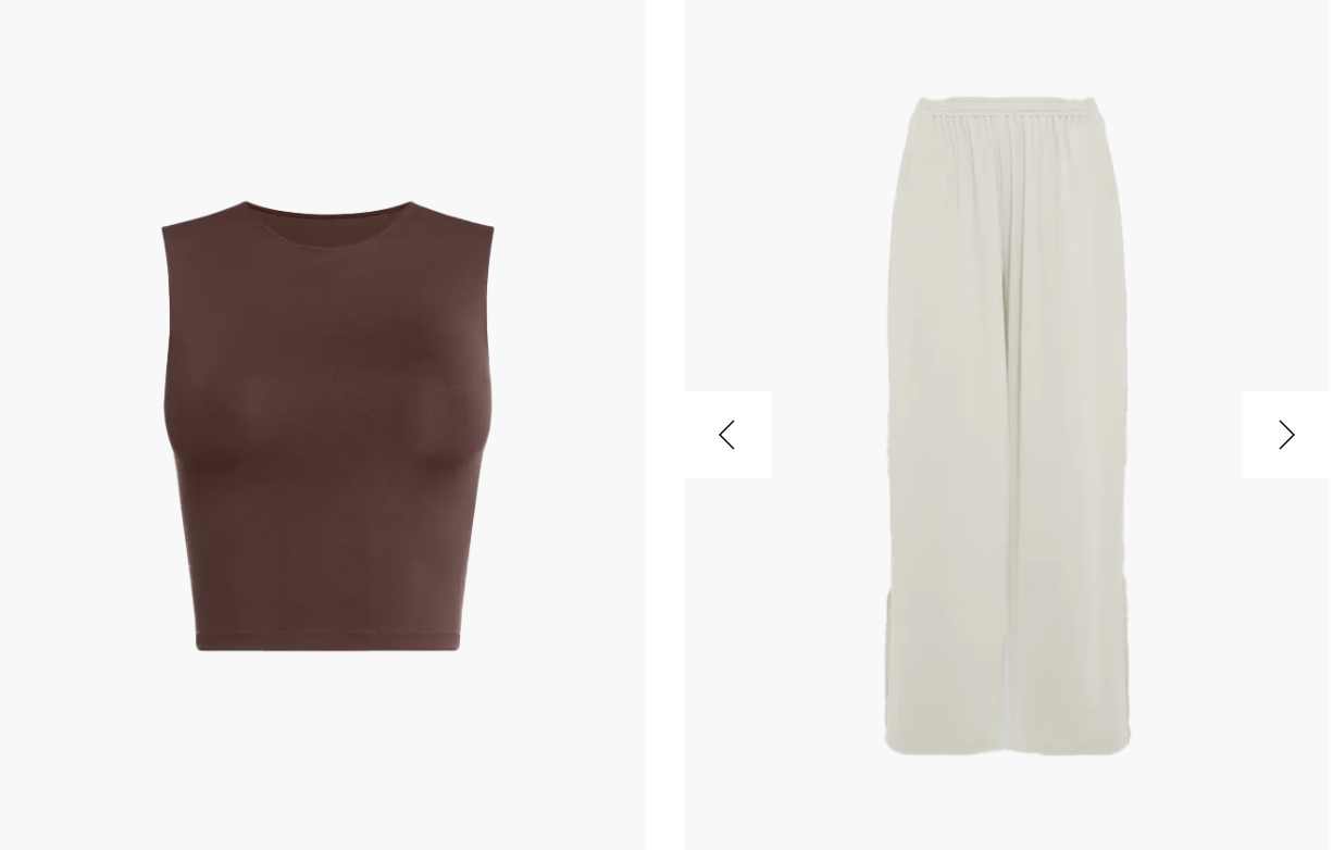 Brązowy, bezrękawnikowy top obok jasnych, szerokich spodni. Ubrania w minimalistycznym stylu.