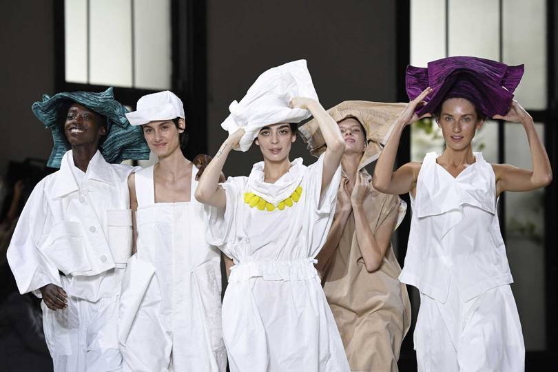 At Issey Miyake Spring/Summer 2019, Creative Director Yoshiyuki Miyamae launched a new technical material – Dough Dough – that can be folded and twisted into shape, as shown here on hats and headpieces. Credit: GETTY