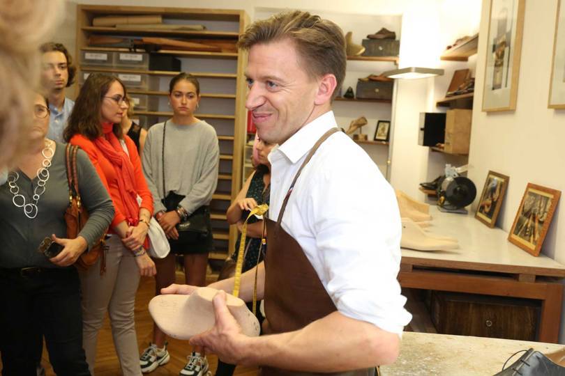 A Berluti craftsman shows visitors the lasts and production process behind the brands bespoke footwear range during Les Journées Particulières LVMH 2018. Credit: OLIVIER VIGERIE / BERLUTI