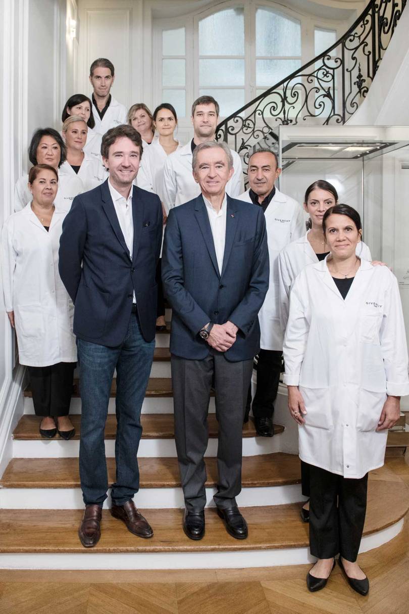 At the Maison Givenchy in Paris, Antoine Arnault (left) and his father, LVMH CEO Bernard Arnault, celebrate the couture craftspeople behind the beautiful clothes and introduce them to the public during Les Journées Particulières LVMH2018. Credit: GABRIELLE DE LA CHAPELLE / GIVENCHY