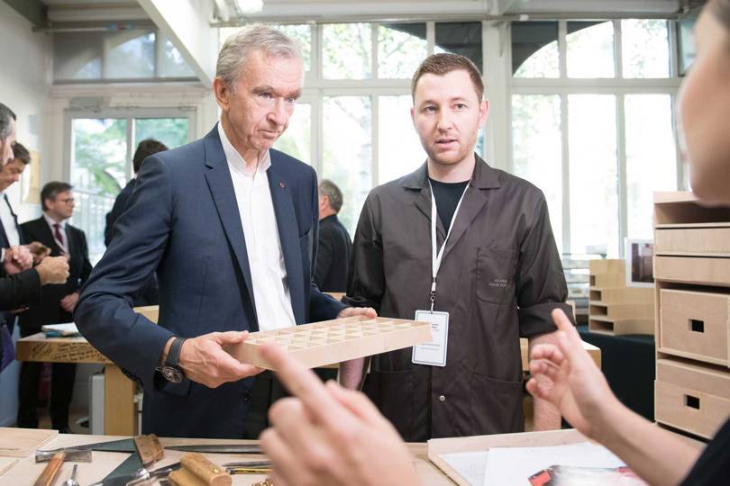 LVMH CEO Bernard Arnault tours the trunk-making workshops at the Vuitton familys historic home and atelier in Asnières-sur-Seine outside Paris as part of the Journées Particulières LVMH 2018 open-house event. Credit: GABRIEL DE LA CHAPELLE / LOUIS VUITTON
