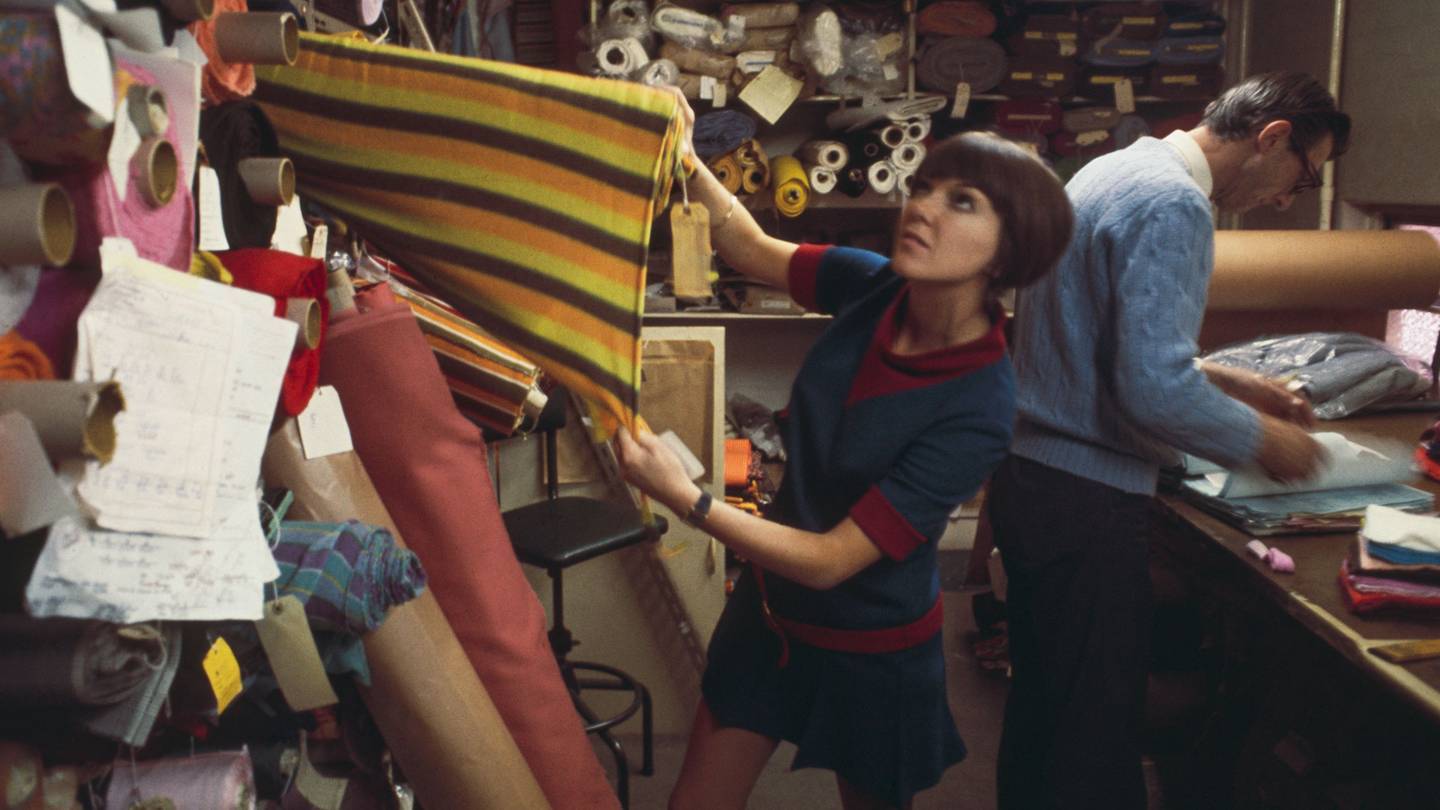 Mary Quant selecting fabric in London in 1967 Credit: ROLLS PRESS / POPPERFOTO / GETTY IMAGES