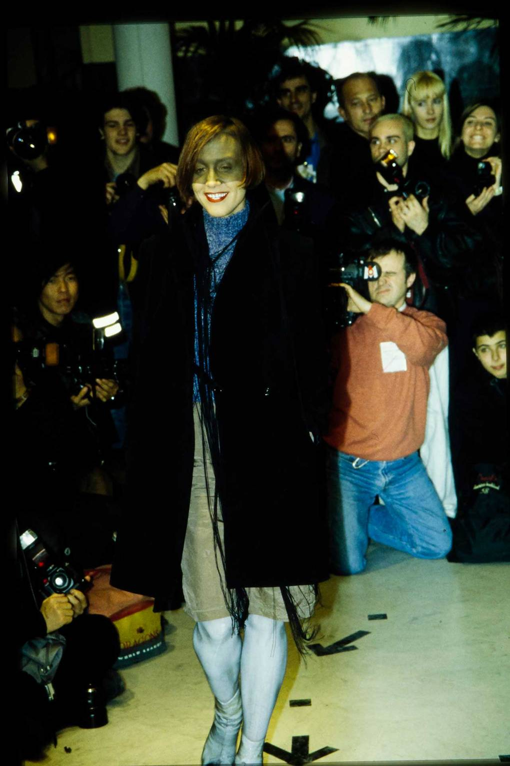 A model in a deconstructed coat and Tabi boots at a Martin Margiela show, Autumn/Winter 1996 (Photo: Getty Images)