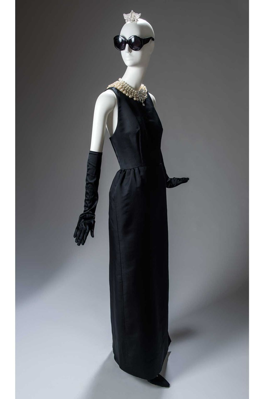 The Givenchy evening sheath dress worn by Holly Golightly, as played by Audrey Hepburn, in the opening scene of the Blake Edwards film, Breakfast at Tiffanys, 1961. Following its debut in the film, the black sheath has become an eternal element of the style lexicon (Photo: Luc Castel, Givenchy)