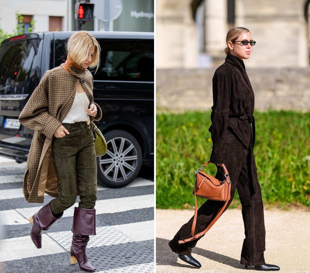 Dwie kobiety w stylowych outfitach: jedna w brązowym płaszczu i zielonych spodniach, druga w czarnym komplecie z torebką.