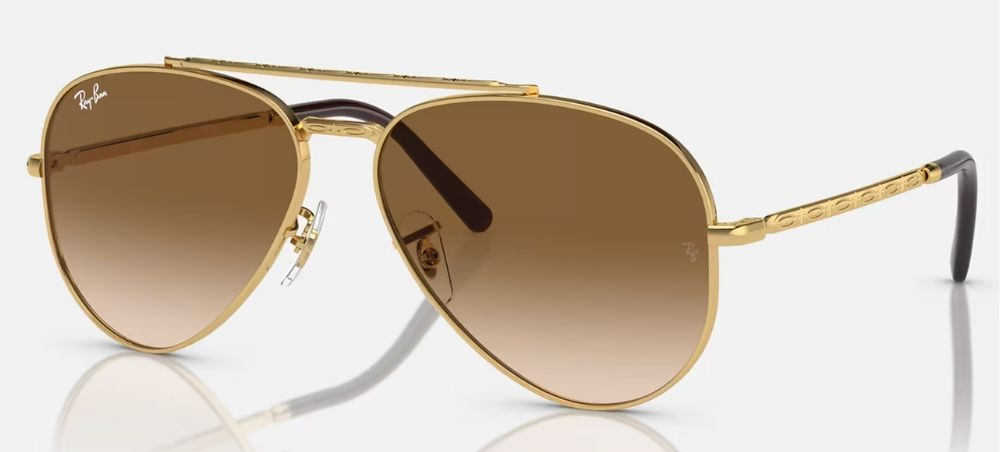 Damskie okulary przeciwsłoneczne 2025 w stylu aviator, z brązowymi soczewkami i złotą oprawką.